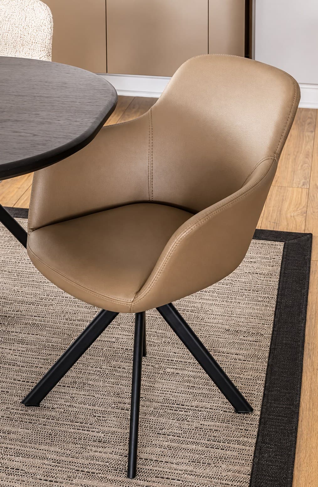 Vira swivel chair by M-FOUR, in an interior