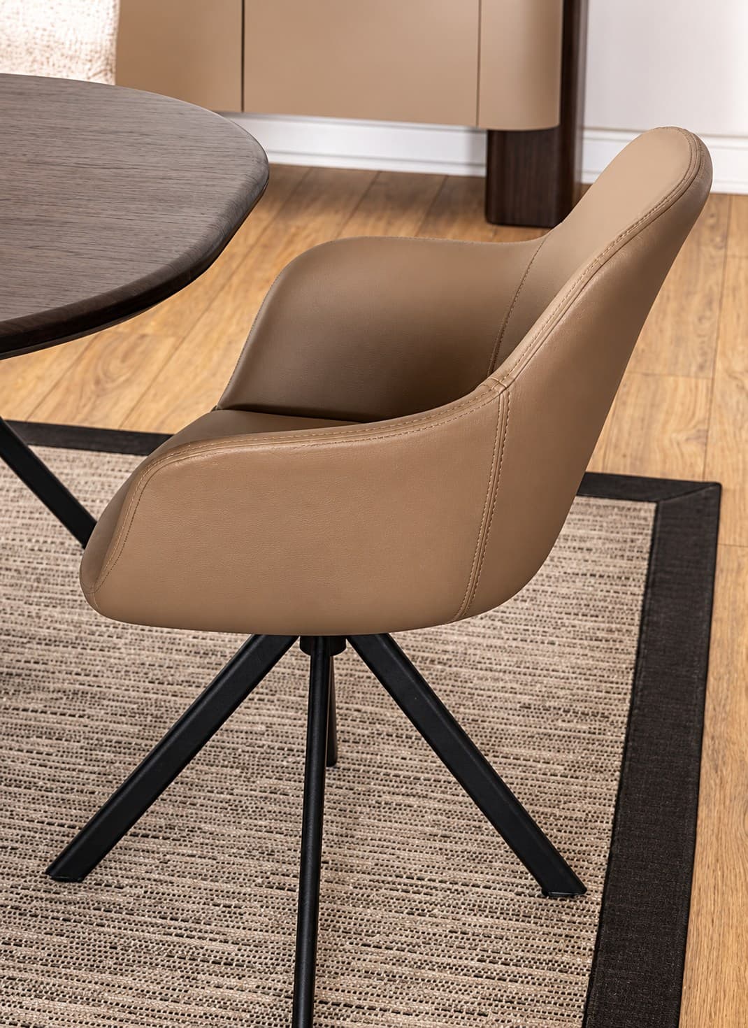 Vira swivel chair by M-FOUR, in an interior